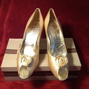 Bruno Magli champagne colored silk evening shoe with rosette on the toe.